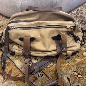 Filson Large Duffel Bag: canvas material, bridle leather straps & brass hardware